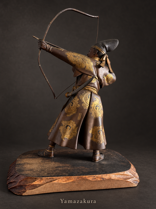 Rear view of bronze archer with gilt bird roundels; Yamazakura styled presentation